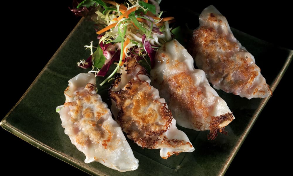 Gyoza de cerdo y cebollino a la plancha. (4 unidades)